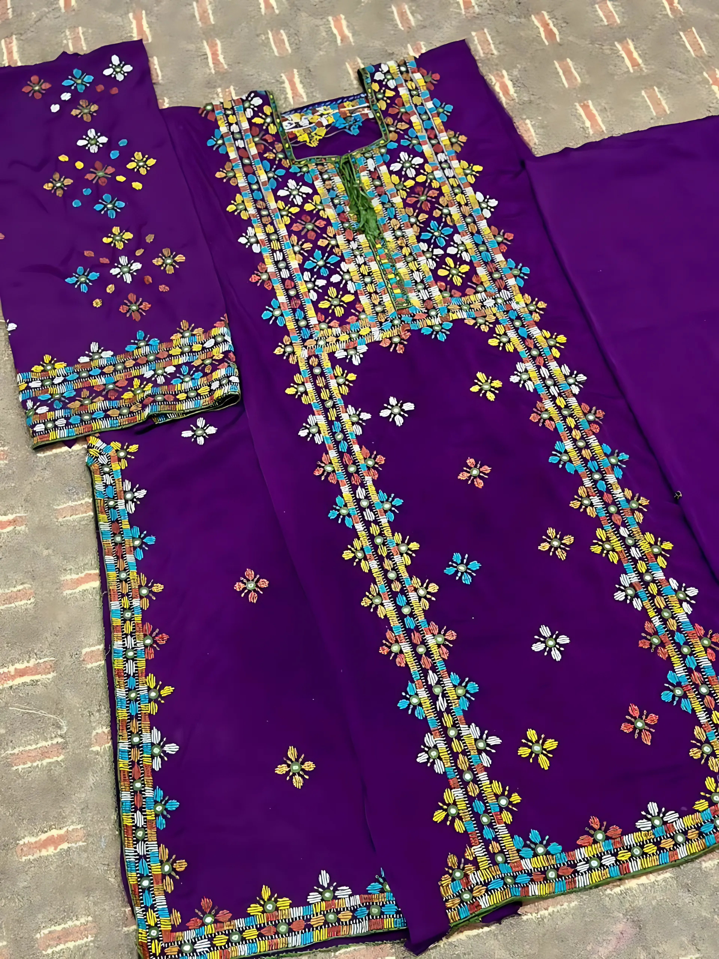 traditional 2-piece Balochi embroidered suit in purple fabric with multicolor threadwork, handcrafted ethnic Pakistani wear for Eid and festive events.