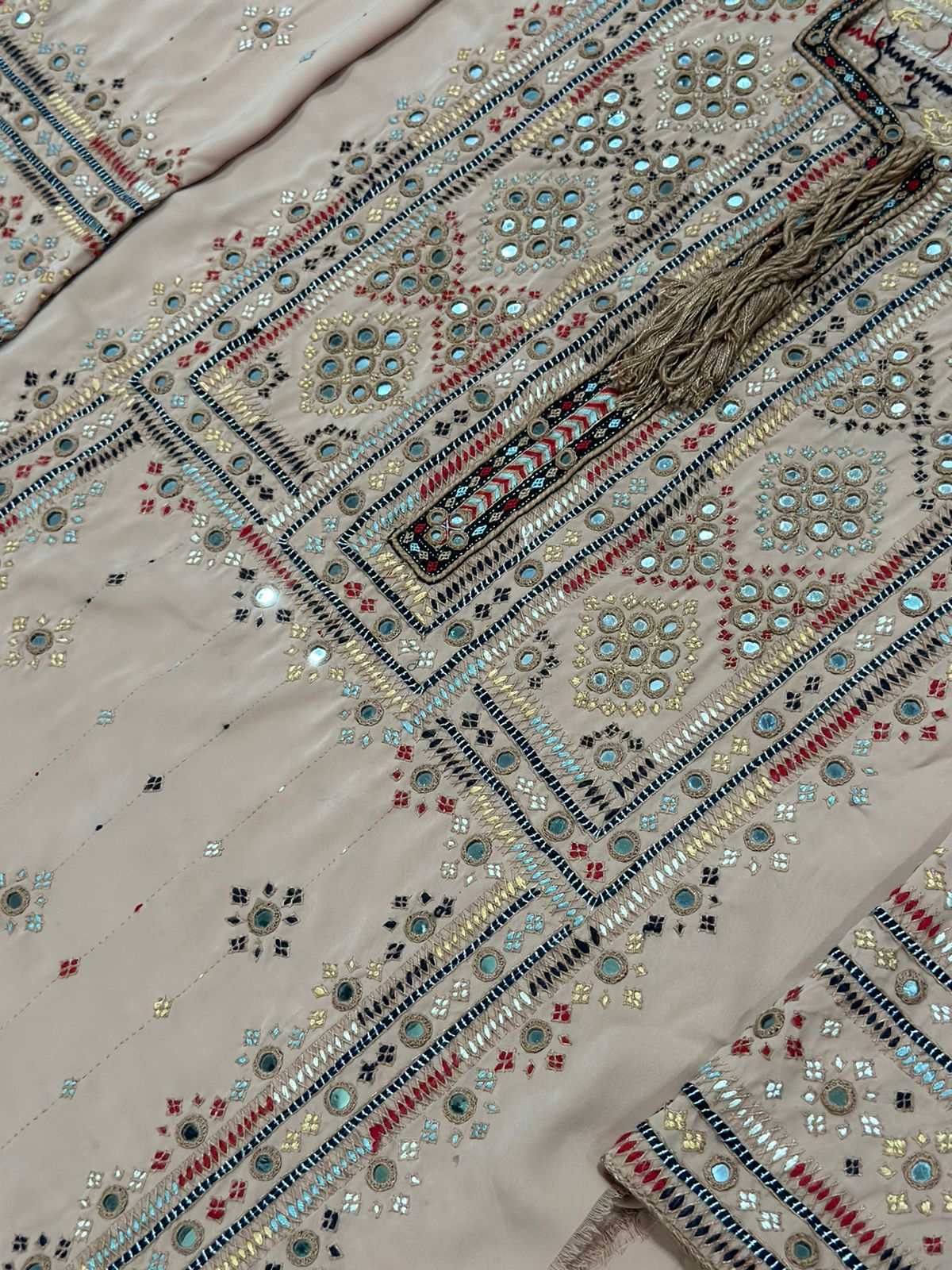  Handmade Balochi Mirror Embroidery Kurta in beige – traditional Pakistani ethnic dress for women with colorful threadwork and mirror details